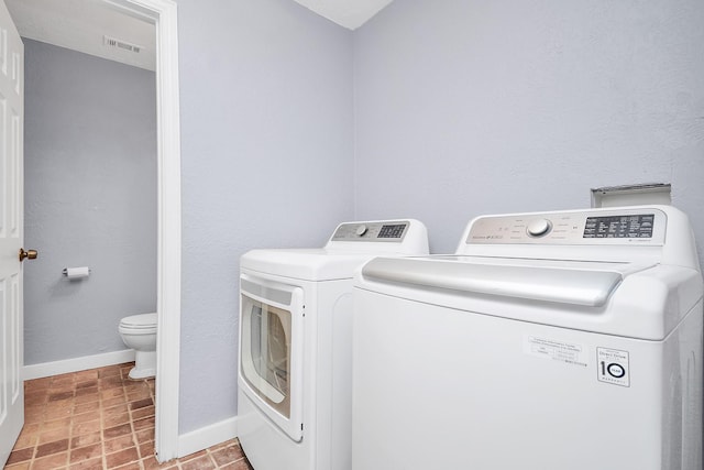 washroom with washer and clothes dryer