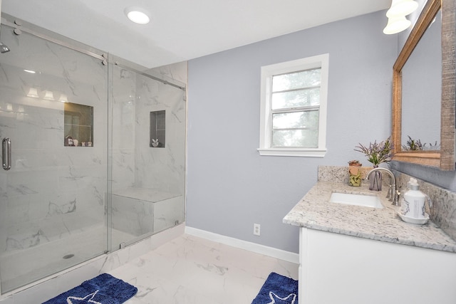 bathroom featuring vanity and an enclosed shower