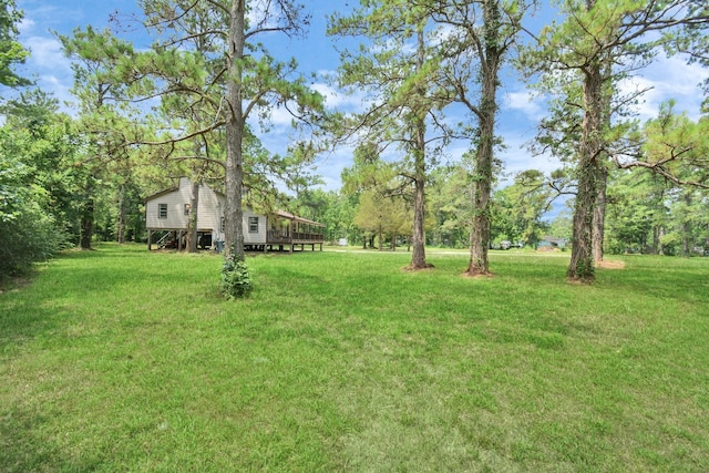 view of yard with a wooden deck