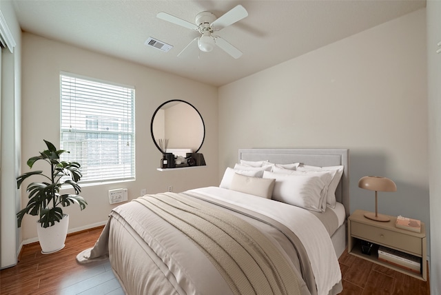 bedroom featuring hardwood / wood-style floors and ceiling fan