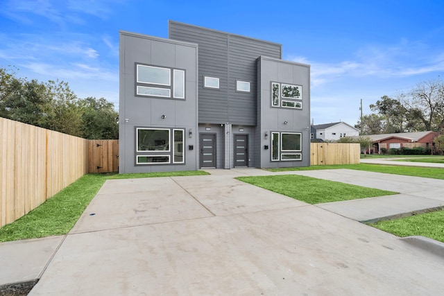 contemporary house with a front yard