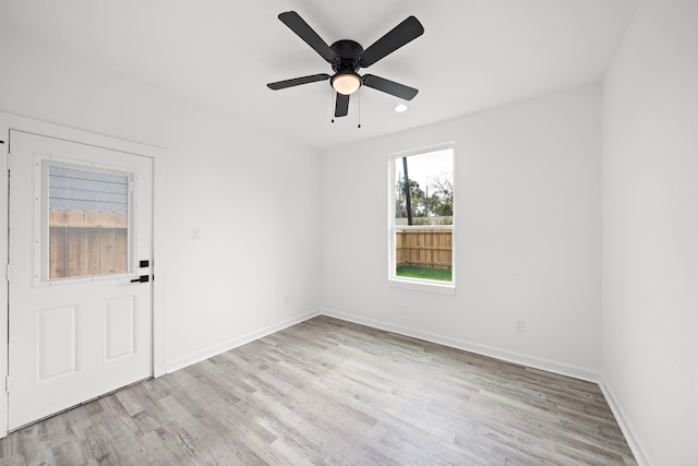 spare room with ceiling fan and light hardwood / wood-style floors