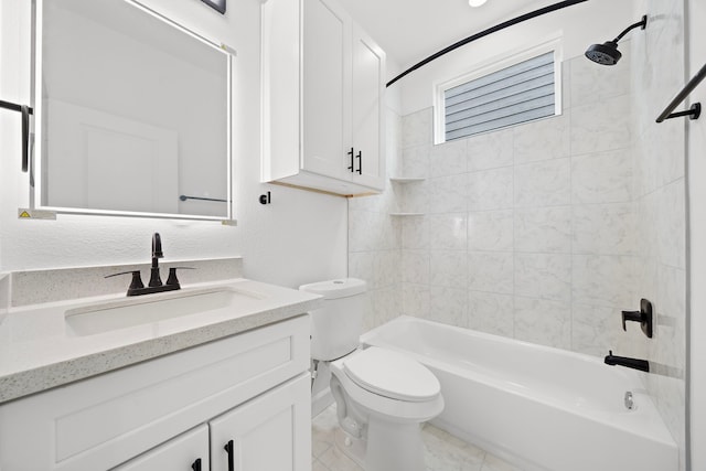 full bathroom with vanity, tiled shower / bath combo, and toilet