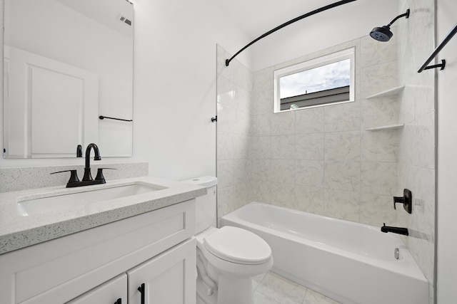 full bathroom with tiled shower / bath combo, toilet, and vanity