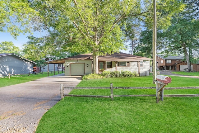 view of front of property with a carport, a garage, and a front yard