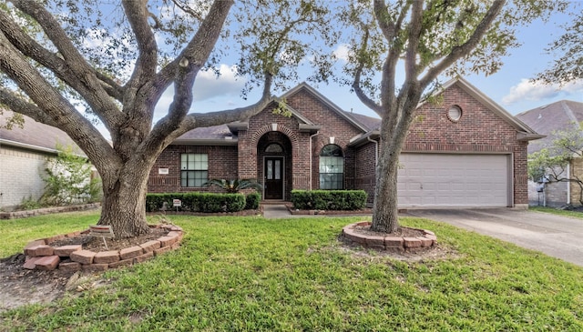 view of front facade with a front yard and a garage