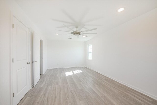 unfurnished room with light hardwood / wood-style flooring and ceiling fan