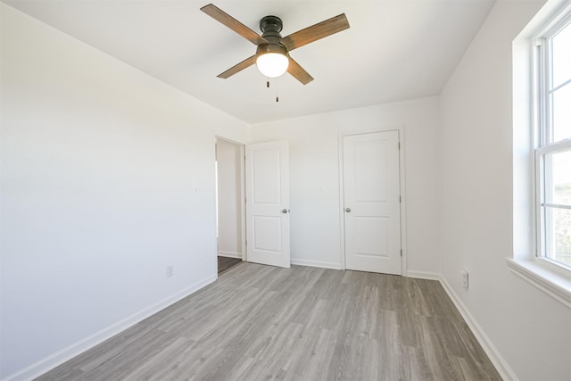 unfurnished bedroom featuring light hardwood / wood-style floors and ceiling fan