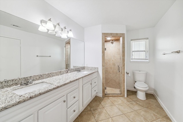 bathroom featuring tile patterned flooring, vanity, an enclosed shower, and toilet