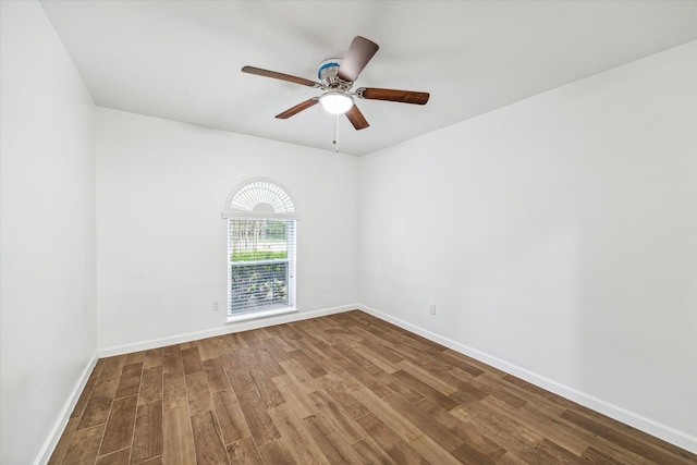 empty room featuring hardwood / wood-style floors and ceiling fan