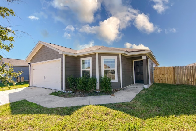 ranch-style home with a front yard and a garage