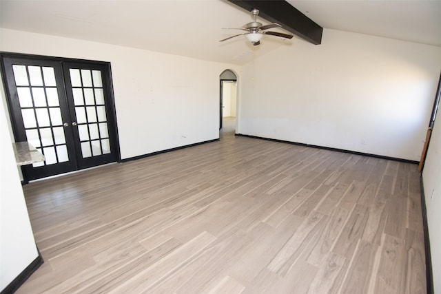 unfurnished room with vaulted ceiling with beams, french doors, and light wood-type flooring