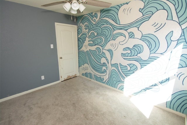 unfurnished room with carpet and ceiling fan