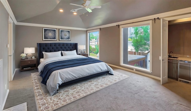 carpeted bedroom with ceiling fan, crown molding, sink, and vaulted ceiling