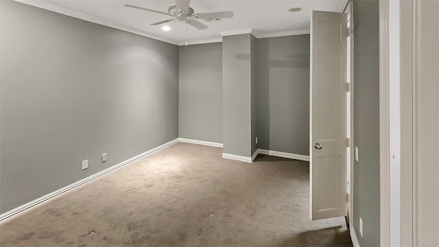 unfurnished room featuring crown molding, carpet floors, and ceiling fan