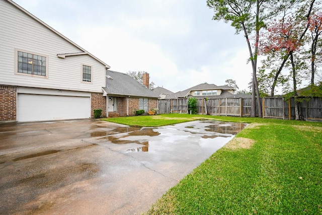 view of yard featuring a garage