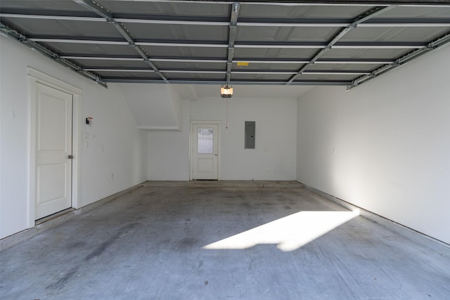 garage with electric panel and a garage door opener