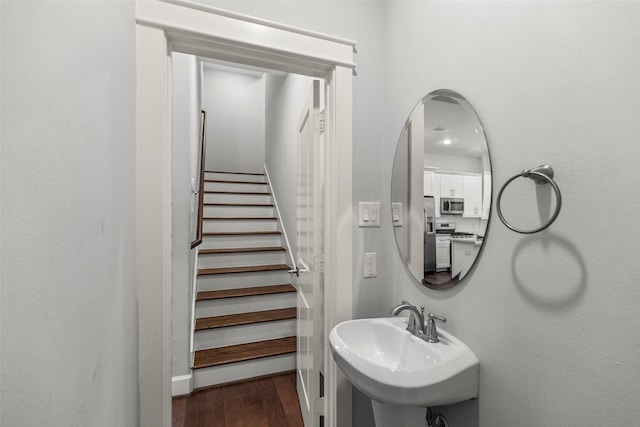 bathroom featuring wood-type flooring and sink