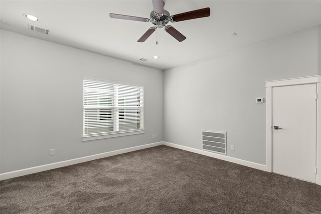 empty room featuring carpet floors and ceiling fan