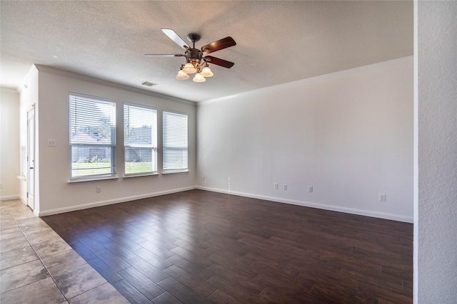 unfurnished room with ceiling fan, dark hardwood / wood-style flooring, a textured ceiling, and ornamental molding