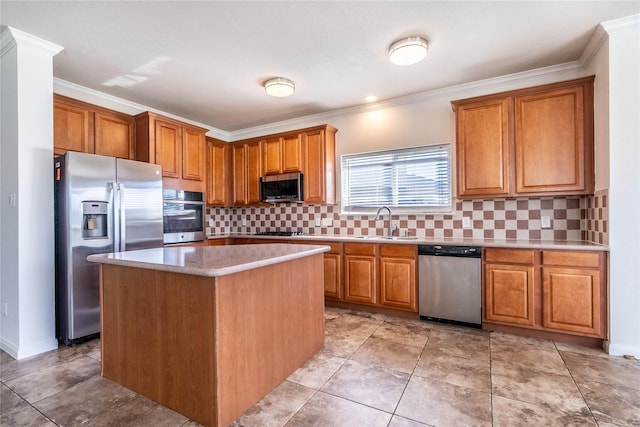 kitchen with appliances with stainless steel finishes, backsplash, crown molding, sink, and a kitchen island