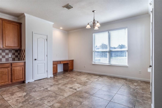 unfurnished dining area featuring ornamental molding, light tile patterned floors, and a notable chandelier