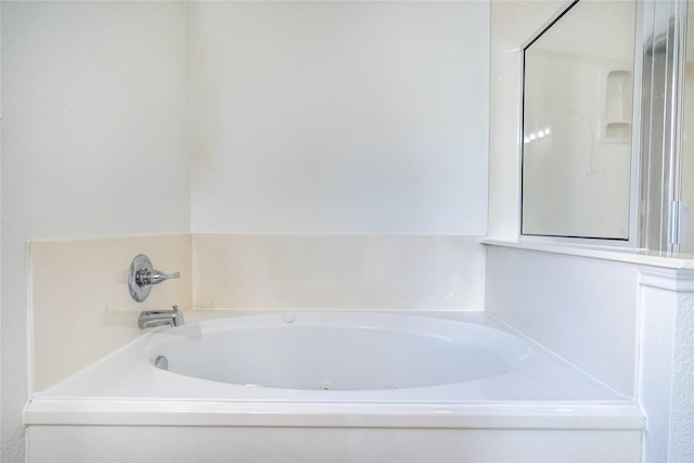 bathroom featuring a tub to relax in