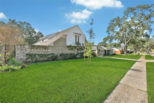 view of home's exterior featuring a lawn