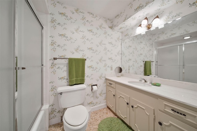 full bathroom with vanity, toilet, and combined bath / shower with glass door