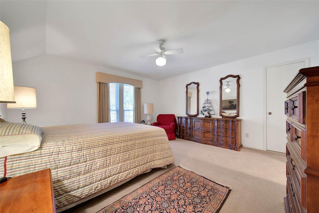 bedroom featuring ceiling fan, carpet, and vaulted ceiling