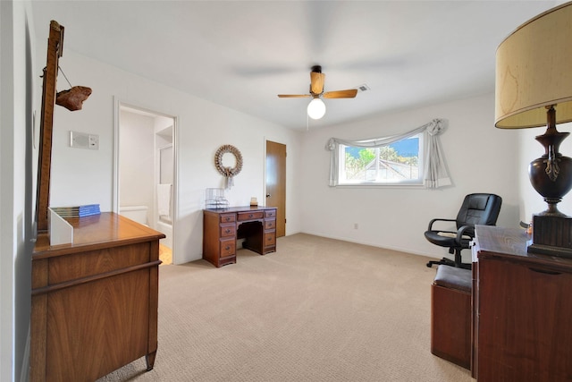 office area featuring ceiling fan and light carpet