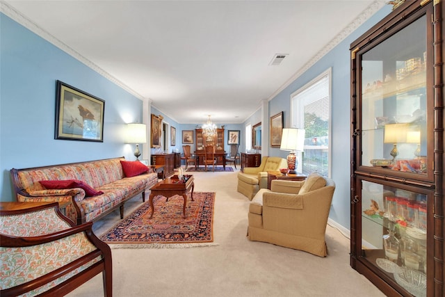 living room featuring carpet flooring, ornamental molding, and an inviting chandelier