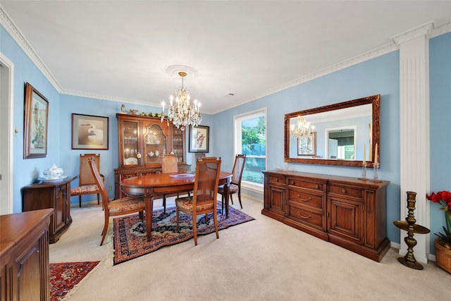 dining area featuring crown molding, light carpet, and an inviting chandelier