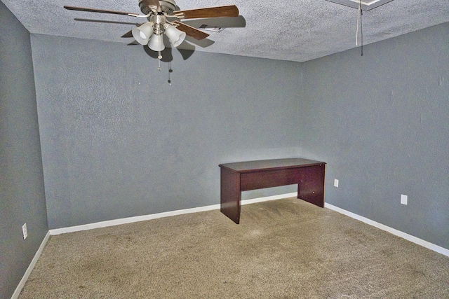 spare room with carpet, a textured ceiling, and ceiling fan