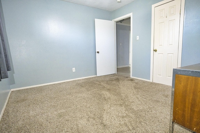 unfurnished bedroom with carpet