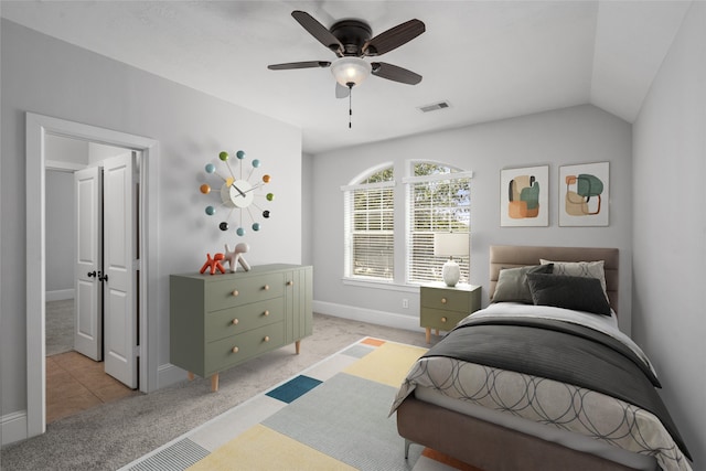 carpeted bedroom with ceiling fan and lofted ceiling