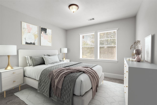 bedroom featuring light carpet