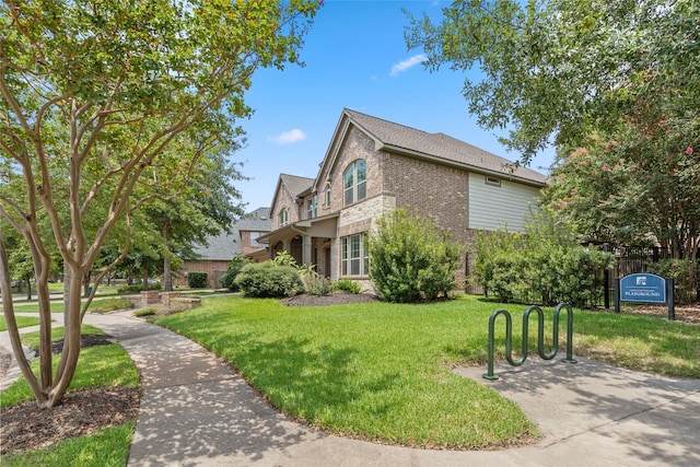 view of property exterior featuring a lawn