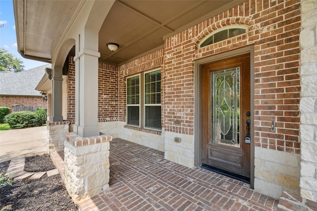 doorway to property featuring covered porch