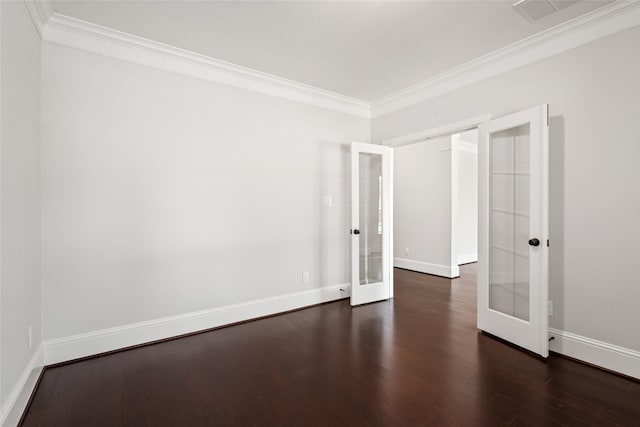 spare room with ornamental molding, dark wood-type flooring, and french doors