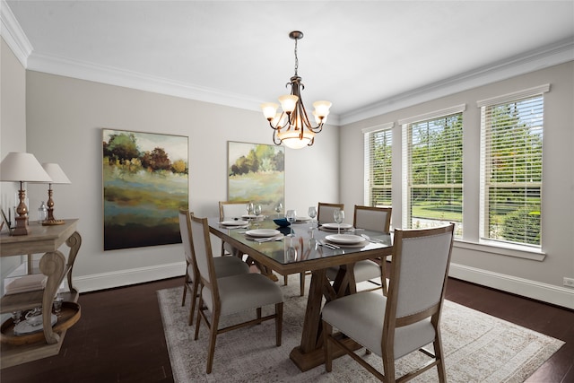 dining area with crown molding, dark hardwood / wood-style floors, and an inviting chandelier