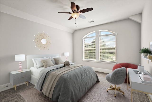 carpeted bedroom featuring ceiling fan and vaulted ceiling