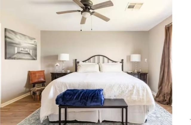 bedroom featuring ceiling fan and light hardwood / wood-style floors