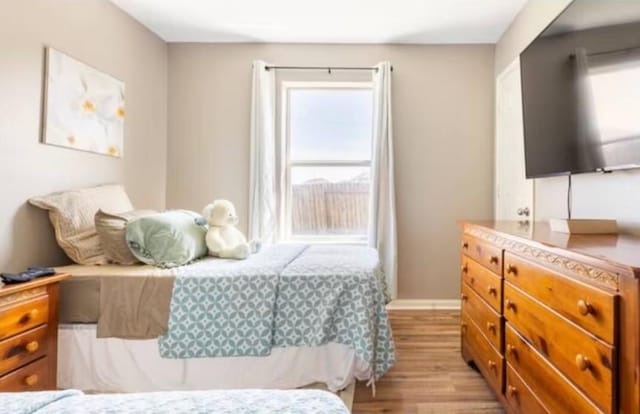 bedroom with light hardwood / wood-style flooring