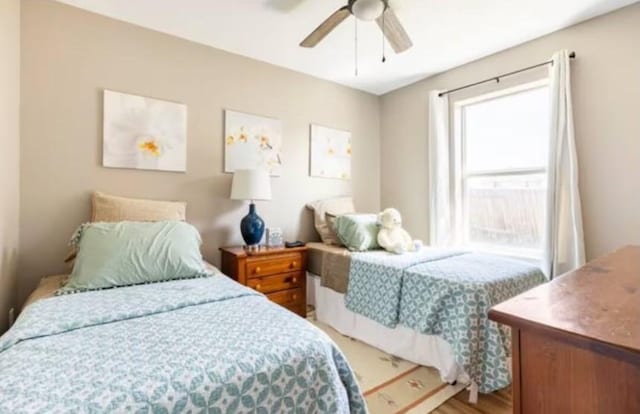 bedroom featuring hardwood / wood-style flooring and ceiling fan