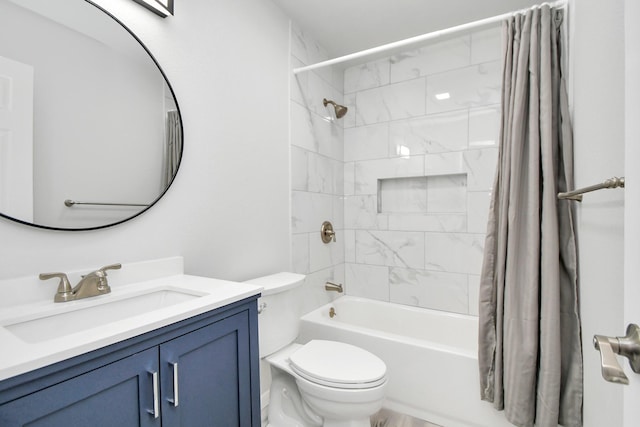 full bathroom with vanity, toilet, and shower / tub combo with curtain