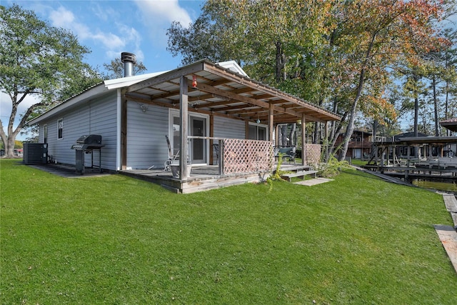 rear view of house with a lawn