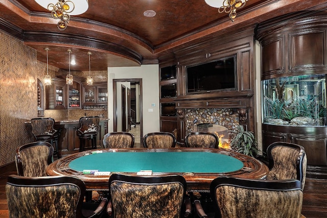 playroom featuring ornamental molding and vaulted ceiling