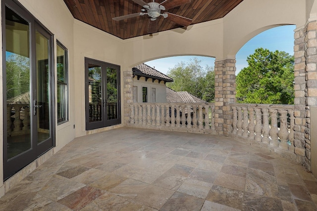 view of patio featuring ceiling fan and french doors