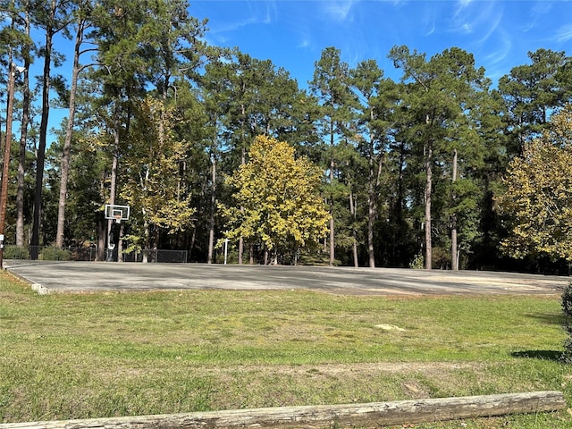 view of yard with basketball court